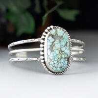 large oval turquoise with brown matrix natural stone bezel set accented with twisted wire and beads on a 3 wire stamped sterling silver cuff large oval turquoise with brown matrix natural stone bezel set accented with twisted wire and beads on a 3 wire stamped sterling silver cuff